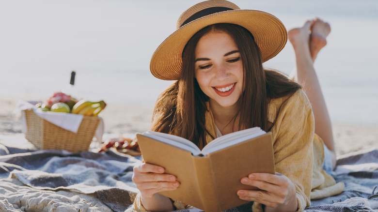 woman reading on the beach