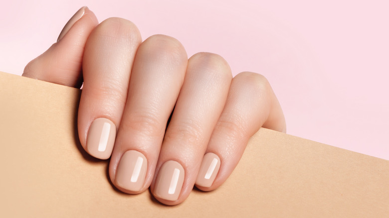 neutral nude nails on hand