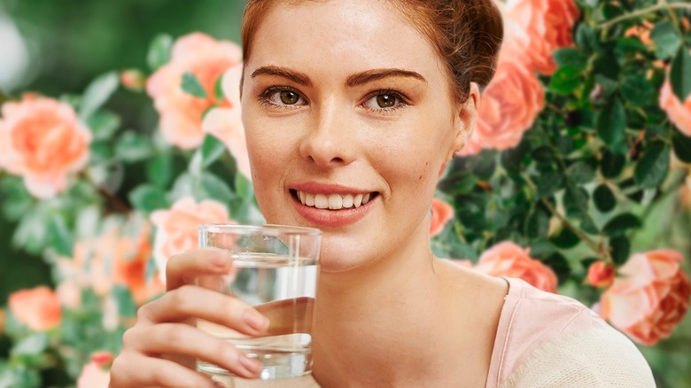 woman drinking rose water