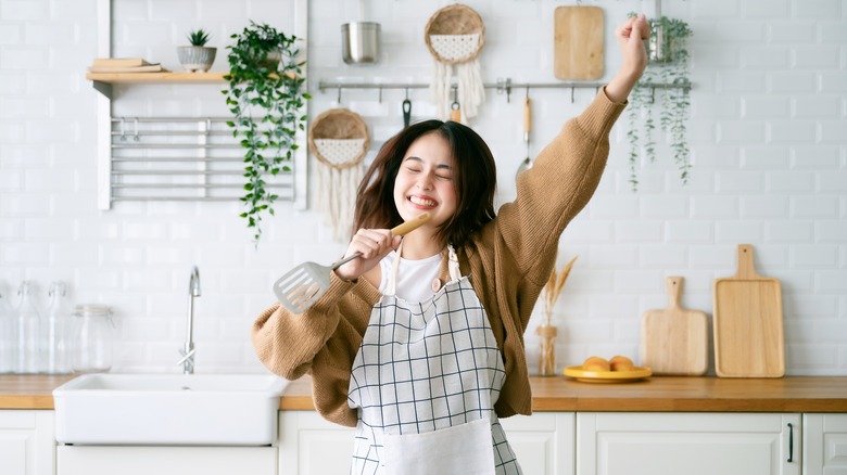 Woman happy cooking