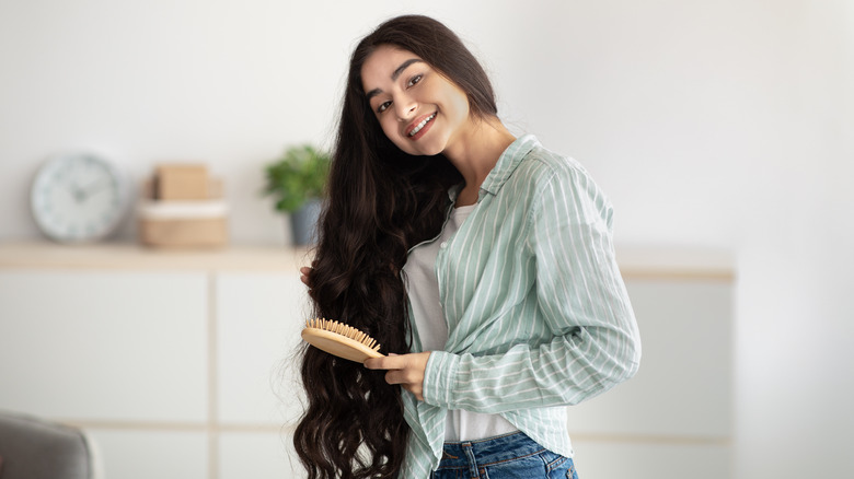 Woman brushing her long hair