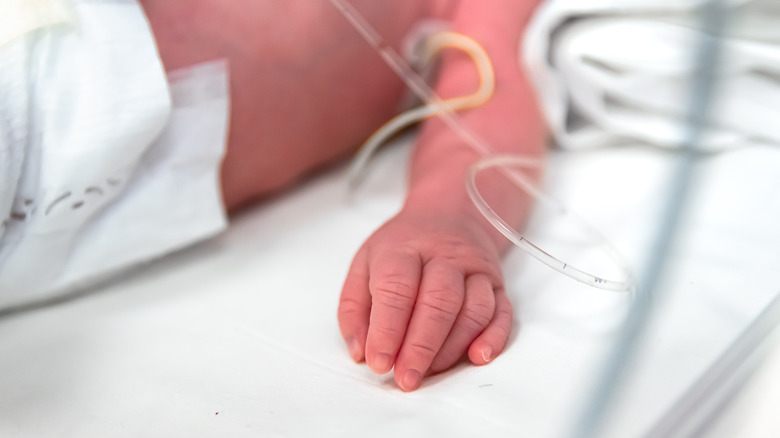 hand of newborn baby in NICU