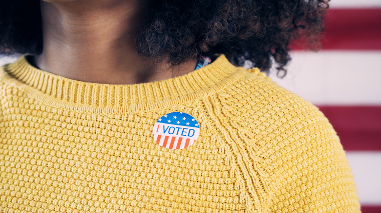 girl wearing "i voted" sticker