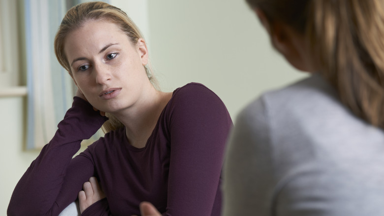 woman unsure talking to therapist
