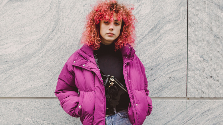 Model wearing pink puffer jacket