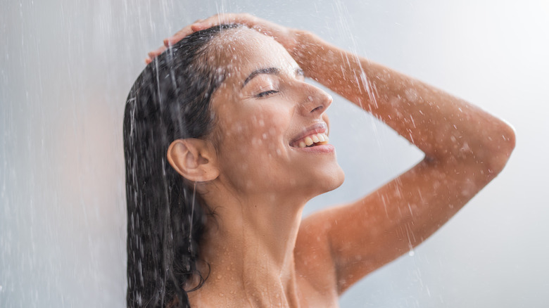 Woman enjoying taking a shower
