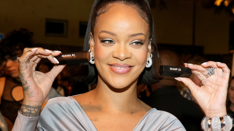Rihanna holds lipstick 