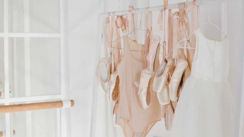 Ballet-wear hanging on a rack.