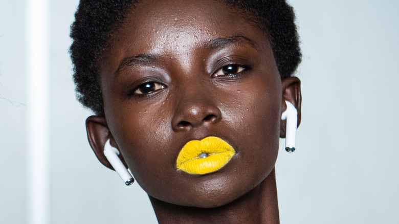 Woman wearing yellow lipstick